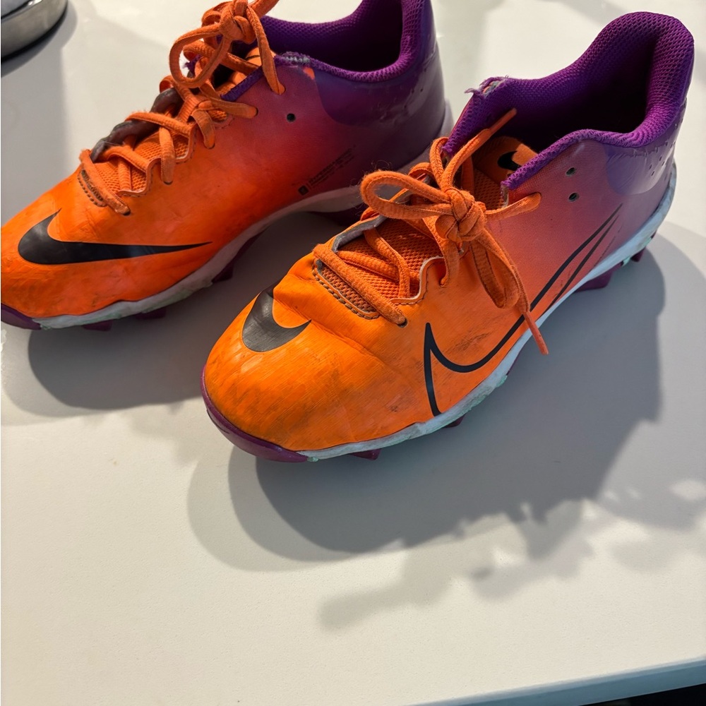 Used Nike Kids Orange and Purple soccer cleats
